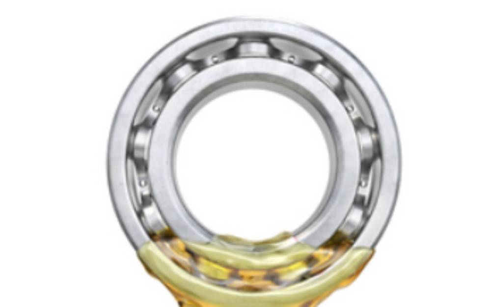 What should I use to lubricate deep groove ball bearings and how often should I lubricate them?
